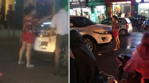 Hà Nội: Vợ ôm con chặn cửa xe ô tô đánh ghen, bồ nhí quáng quàng tháo chạy - Ảnh 1